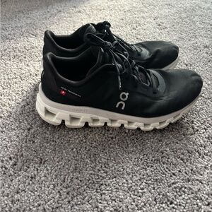 On Running Black Athletic Shoes with White Sole